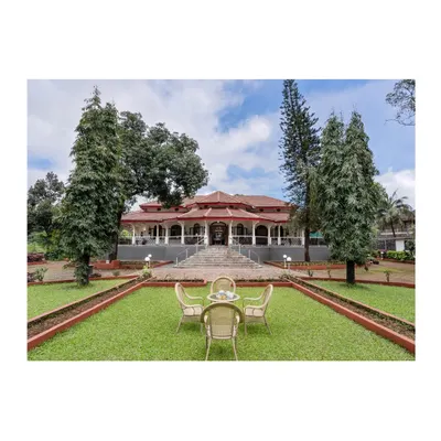 A wide view of the fully restored century-old building in Lonavala, set within its manicured landscape. The project balanced preservation of the original Indo-Saracenic character with necessary structural and functional upgrades.
