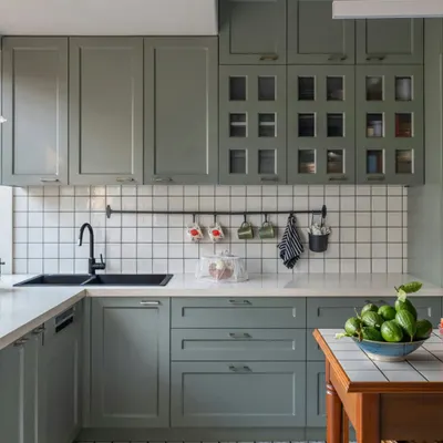 The kitchen is the heart of every home. In this Calcutta residence, we used calming sage green cabinetry, classic white tiles, and patterned flooring to create a space that is both welcoming and functional. The design honors the local love for home-cooked food and shared moments.