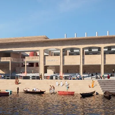 A daytime render of the redeveloped Manikarnika Ghat, viewed from the Ganga river. The design provides improved access and organized spaces for rituals, using stone heritage to create a structure that feels both timeless and new.