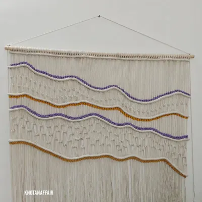 This beautiful 4-foot by 3.5-foot macraweave wall hanging was a recent custom order. I wove in shades of purple and mustard as requested by the client to create this wavy, textured design. If you want a unique piece for your home, I'm just a message away.