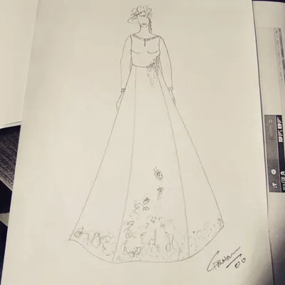 A hand-drawn fashion sketch for a client's custom gown. This is where we finalize the silhouette and embroidery placement before moving on to fabric selection and pattern making.