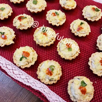 My bite-sized Creamy Chicken and Cheese Tarts are perfect for any party. Each savory tart has a flaky crust filled with a rich, cheesy chicken mixture, baked until golden and delicious.