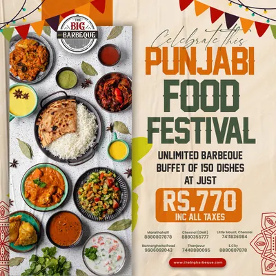 Our Punjabi Food Festival is a feast of rich, hearty flavors. This top-down view displays a complete thali experience with various curries, raita, flatbread, rice, and samosas, showcasing the variety within a single regional cuisine.