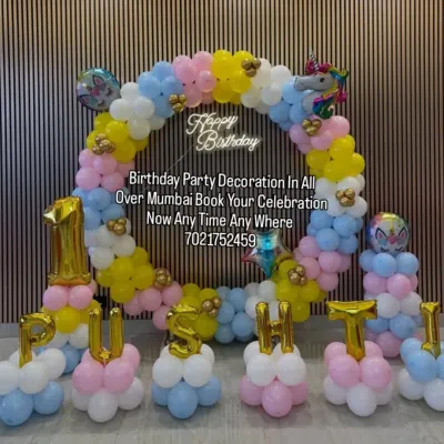 A dreamy unicorn-themed decoration for Pushti's birthday. This setup features a pastel-colored balloon ring, unicorn foil balloons, and custom name lettering made from balloons.
