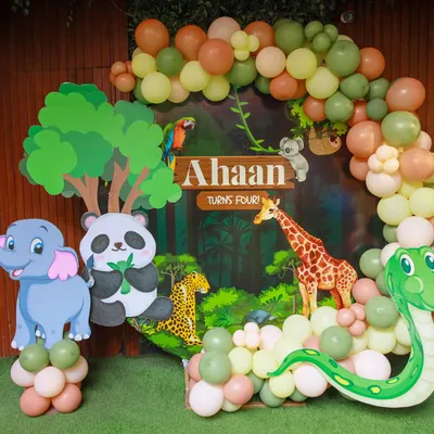 Welcome to the jungle. Our safari-themed backdrops are full of friendly animals like pandas, elephants, and snakes, set against a lush jungle scene with a custom nameplate for the birthday child.
