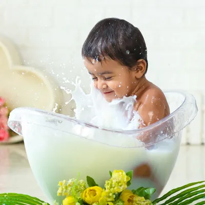 A joyful splash in the milk bath. This creative session is all about capturing pure, uninhibited fun and results in truly unique and artistic photos.