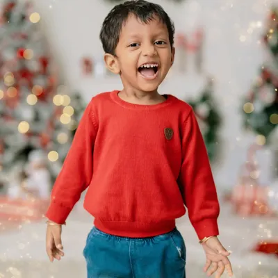 The pure, uncontainable joy of the holiday season. This little boy's explosive laughter perfectly captures the magic of Christmas.