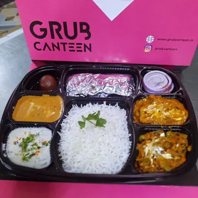 Our most loved Veg Executive Thali, packed and ready for delivery. It includes two vegetable dishes, dal, rice, roti, raita, and a gulab jamun, ensuring a balanced and delicious lunch for office goers.