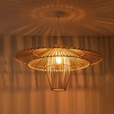 This wide, flower-like bamboo pendant light casts beautiful, patterned shadows on the ceiling, creating a dramatic effect. Its intricate, layered design makes it a stunning centerpiece for a living room or entryway, providing both light and artistry.