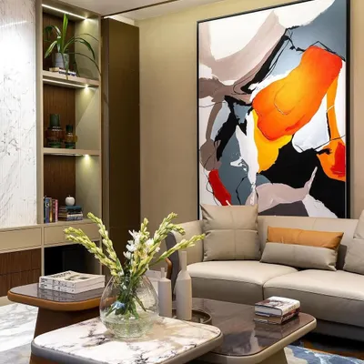 My 'Colour Cluster' abstract painting featured in a client's living room. The large-scale canvas, with its bold splashes of red, orange, and blue, acts as a dynamic and energetic focal point for the entire space.