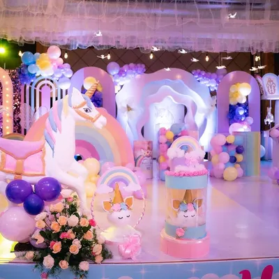 A close-up of the custom-fabricated props for our unicorn-themed party. This life-sized unicorn and the cute unicorn return gift stands were all made in our workshop.