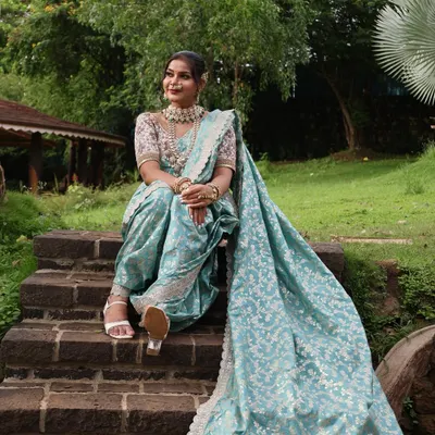 A beautiful pastel blue Nauvari with a silver floral pattern, offering a modern and refreshing take on the traditional attire.