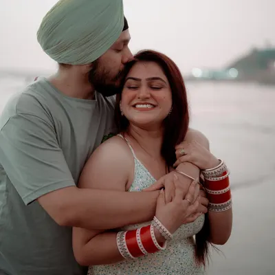 A tender forehead kiss against the soft light of the evening sky in Goa. This post-wedding shoot captures the quiet, happy moments after the main celebration is over.