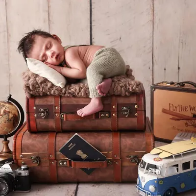 Ready for a lifetime of adventure. This vintage traveler theme is one of my favorites for newborns. With antique-style suitcases, a globe, and a toy plane, we create a scene that tells a story of future explorations.