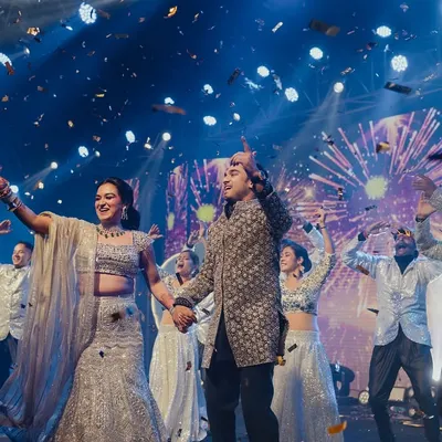 The grand finale of a couple's performance. Nipun and Roshni are showered in confetti, surrounded by dancers, with fireworks on the LED screen. This is the kind of high-energy, celebratory moment we love to create.