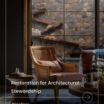 Our blog on restorative design explores how working with what already exists offers environmental responsibility and emotional resonance. This image captures the essence of that philosophy, where a modern chair sits against a backdrop of natural, weathered stone.