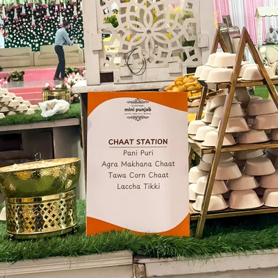 Our dedicated Chaat Station, with a clear menu listing favourites like Pani Puri, Agra Makhana Chaat, and Laccha Tikki. The elegant setup with golden serveware elevates this street food experience.