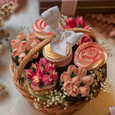 My handcrafted cupcake basket for Mother's Day, featuring an assortment of cupcakes piped with intricate buttercream flowers and nestled in a rustic wicker basket. It's an edible bouquet that tastes as lovely as it looks.