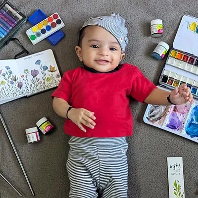 Meet my 'mini me' and the youngest artist in the studio, my daughter Shravya. She already loves being surrounded by watercolors, brushes, and all my art supplies.