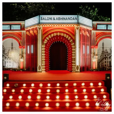 For this Sangeet, we created a grand Bollywood theatre entrance. The red carpet and marquee lights set the stage for a night of cinematic celebration.