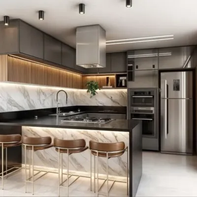 A bold and modern kitchen with dark grey cabinets, a marble-clad breakfast island with under-lighting, and stainless steel appliances for a professional look.