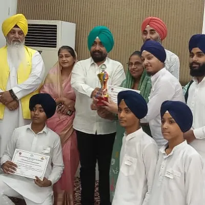 Our students and teachers celebrating a first prize win at a kirtan competition held at Mata Sundri College.