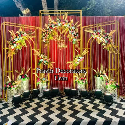 A fun selfie booth for guests to capture memories. We designed this with a 'Better Together' sign, a modern gold-frame backdrop, and colorful floral arrangements on a bold chevron floor.