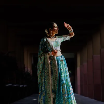 A moment of quiet reflection for the bride. We love this artistic shot, using light and shadow to create a beautiful, soulful portrait before the festivities begin.
