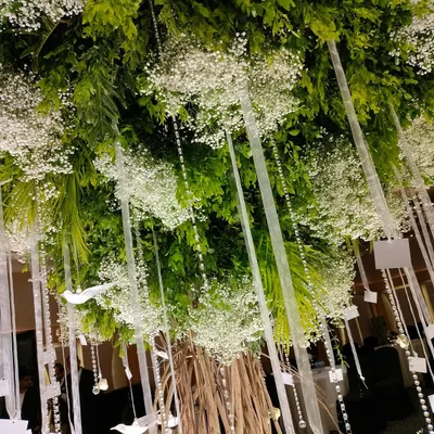 A closer look at our custom-built "Wish Tree." We hung crystals, acrylic birds, and personalized wish cards from its branches, creating an interactive and meaningful centerpiece for the reception.