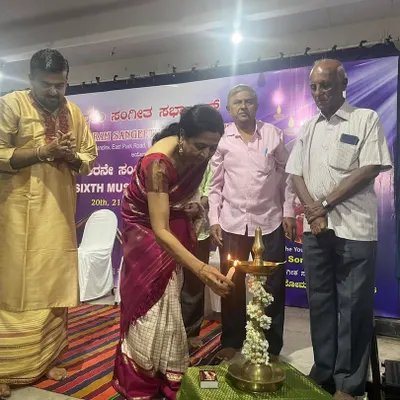 Lighting the lamp to inaugurate the Malleswaram Sangeeta Sabha music conference. This traditional ceremony marks the auspicious beginning of a celebration of music.