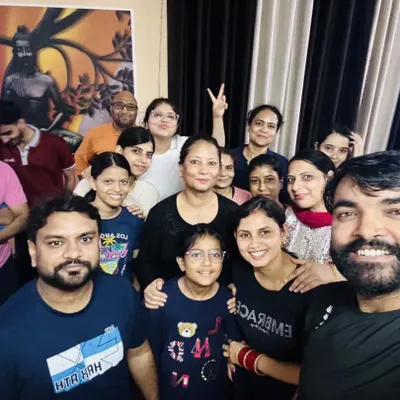 A happy selfie with our yoga family after a fulfilling session. The smiles and sense of connection are just as important as the asanas.