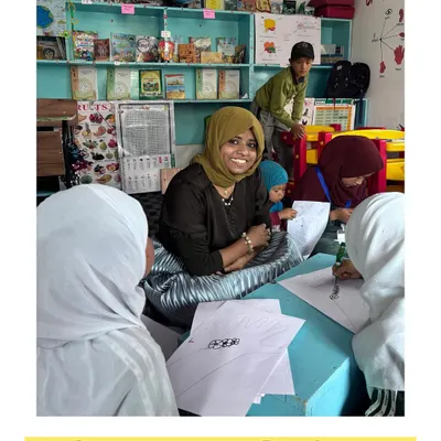 This picture was taken during a workshop, surrounded by my wonderful students. The quote, "Jo himmat na hare, vo zindagi savare," means the one who doesn't lose courage, makes their life better.