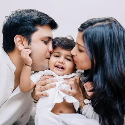 There is so much love in this one frame. A home session allows for these incredibly intimate moments where a baby is showered with affection from both parents. This is the warmth I aim to capture.