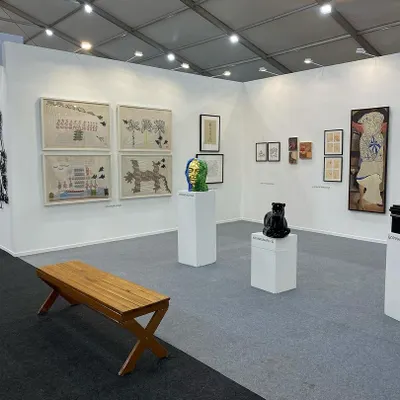 A view of our booth at Art Mumbai, showcasing a diverse range of works including sculptures by Arunkumar H G and Venkat Bothsa, and embroidered works by Archana Hande.