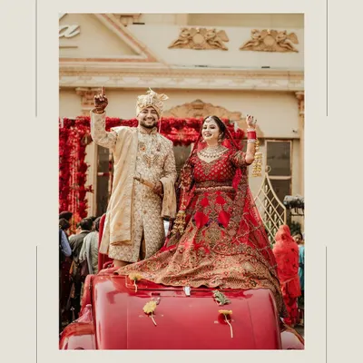 A picture perfect moment. I had the pleasure of dressing this groom in a custom golden-beige sherwani for his big day. The intricate embroidery and tailored fit ensured he looked regal and confident as he celebrated with his bride.