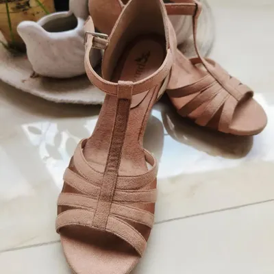 Introducing the Neutral Beige salsa heel, arriving soon. This image shows the soft texture and elegant design of the shoe, a perfect, versatile option for any dancer's wardrobe.