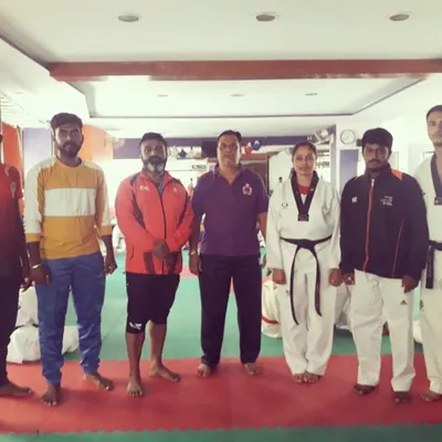 A group photo with my coaching team after a successful Kyorugi seminar. These sessions are about targeted practice to improve sparring skills and fight strategy.