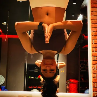 An inverted aerial yoga pose, which is great for spinal decompression and improving circulation. It's a fun way to challenge your body and see the world from a different perspective.