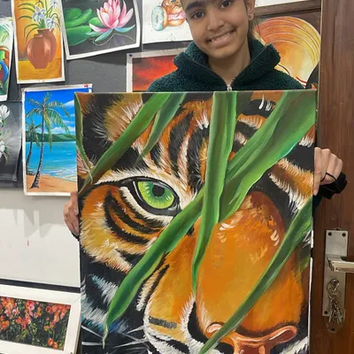 This student's incredible tiger painting shows the advanced techniques we cover, like rendering realistic fur textures and capturing the intensity of the animal's gaze.