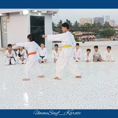 Here, two of my students are performing a Kata in unison. Kata, which means "form" in Japanese, is a pre-arranged sequence of movements that builds discipline, technique, and focus.