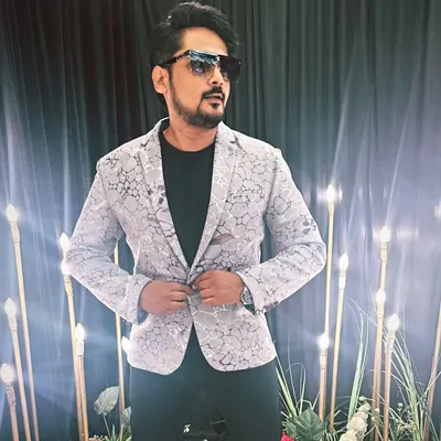 Confidence is the best outfit. Here I am, ready for a show in a stylish blazer, embodying the self-made journey of an event emcee.