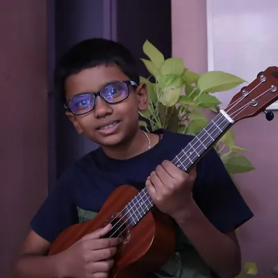 Finding their rhythm, one chord at a time! This is a glimpse of a student's happy ukulele journey at our academy.