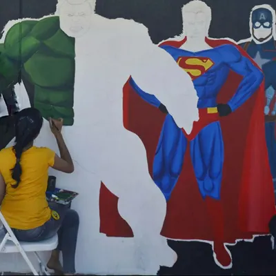 The Hulk is taking shape. This photo shows the process of painting a superhero mural, starting with the iconic green as I bring the character to life piece by piece. It's a perfect theme for a dynamic kid's room wall art.