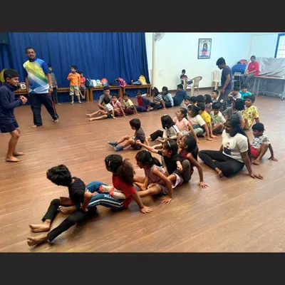 An energetic theatre game in full swing. Activities like these are central to our teaching method, as they break the ice, encourage teamwork, and teach acting principles in a way that feels like play.