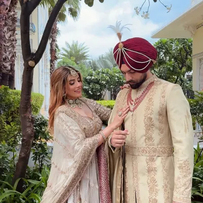 The beauty is in the details. I focus on the small things, like how the groom's ruby necklace subtly picks up the border of the bride's dupatta, creating a connected and thoughtfully styled look.