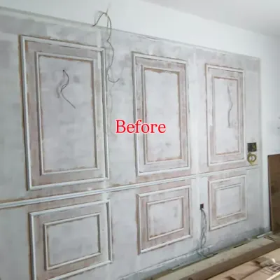 This is the wall before I started, with the basic wainscoting frames installed and ready for finishing. This shows the first step in preparing the wall for the final wallpaper application.