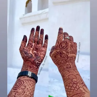 The gorgeous, mature stain after two days. This collage shows the deep red color on both the front and back of the hand, a result of my special organic henna mix.