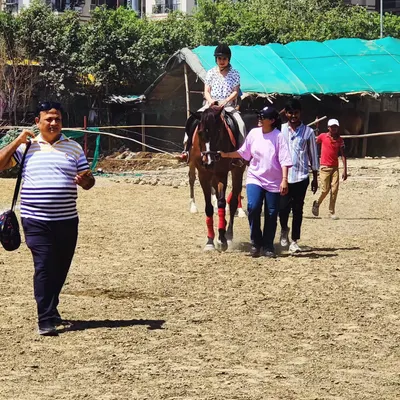 A snapshot from our recent horse riding event, filled with competition and celebration. This shows a family enjoying a guided ride as part of the day's activities.
