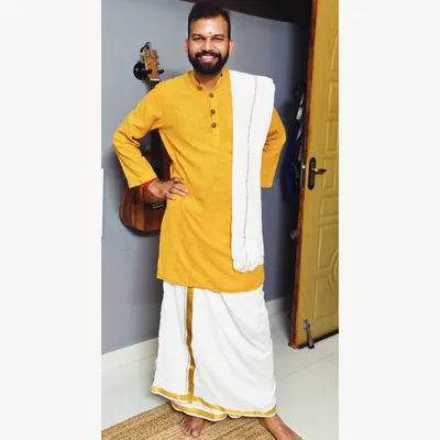 Dressed in a traditional Vesti. I find that wearing simple, natural-fiber clothing is most conducive for my yoga practice and for life.