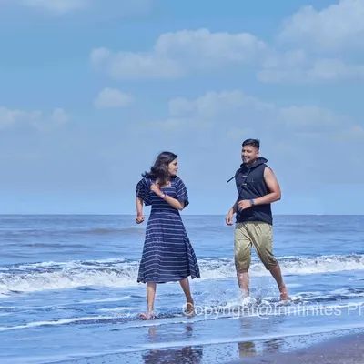 A joyful and carefree moment as a couple runs along the shoreline. We capture the natural beauty of a beach setting for a fun and relaxed pre-wedding shoot.